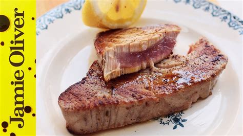 How should a tuna steak be cooked?